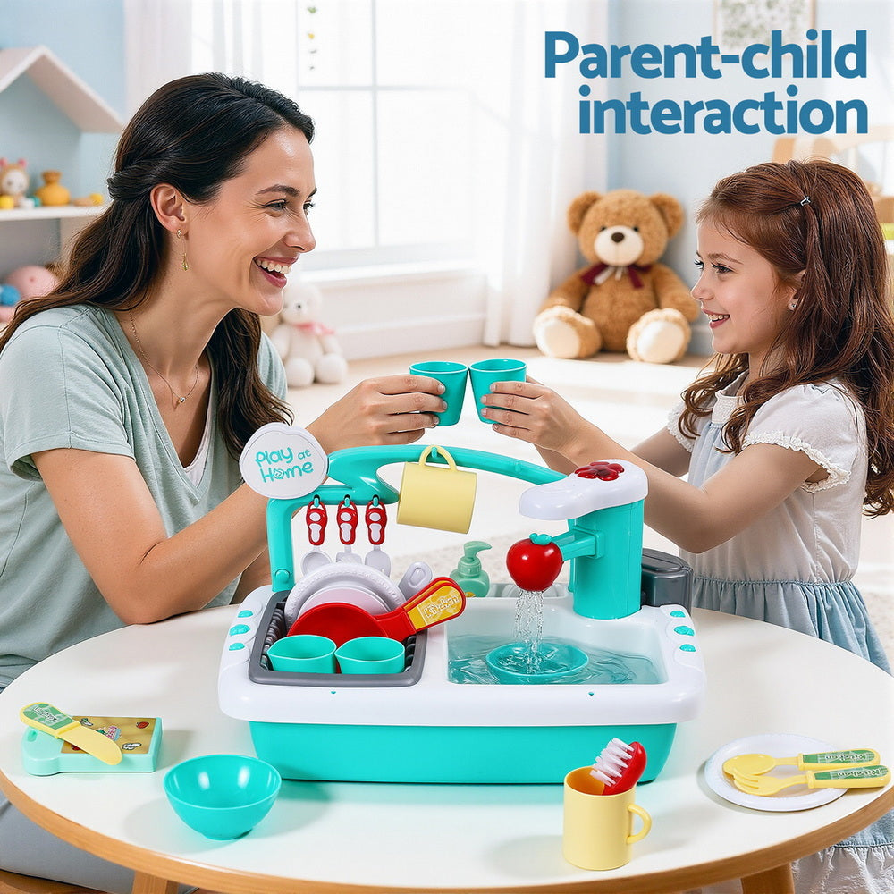 Woman and child playing with a toy kitchen set in a bright room.