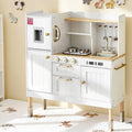 White children's play kitchen with wooden accents on a light-colored floor.