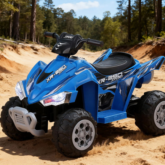 Blue toy ATV on a sandy surface with trees in the background