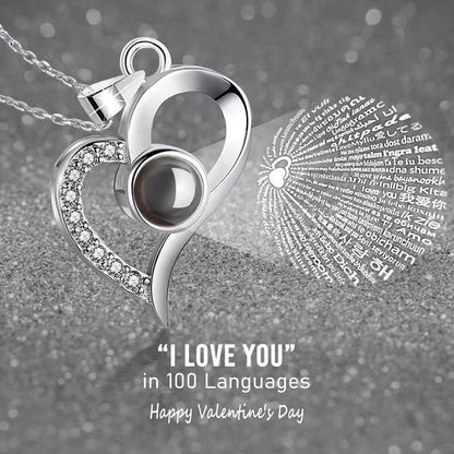 Platinum heart-shaped projection necklace, engraved with 100 ways to say "I love you," paired with matching heart-shaped earrings, presented in a rose-adorned double-door gift box—a refined gift blending technology and romance.