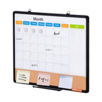 Dry erase calendar with magnetic markers on a white background